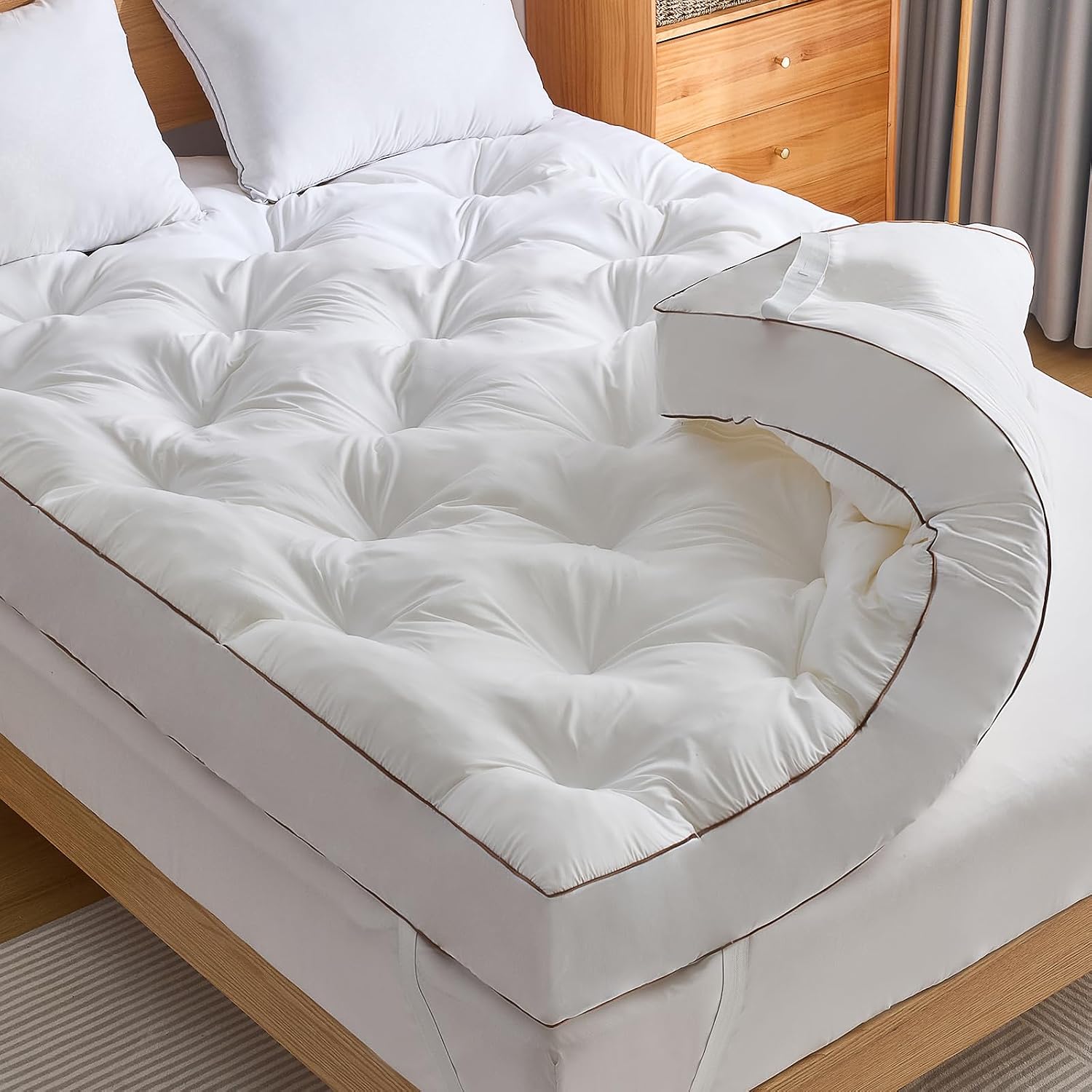 WhatsBedding four inch gel memory foam mattress topper on a queen bed